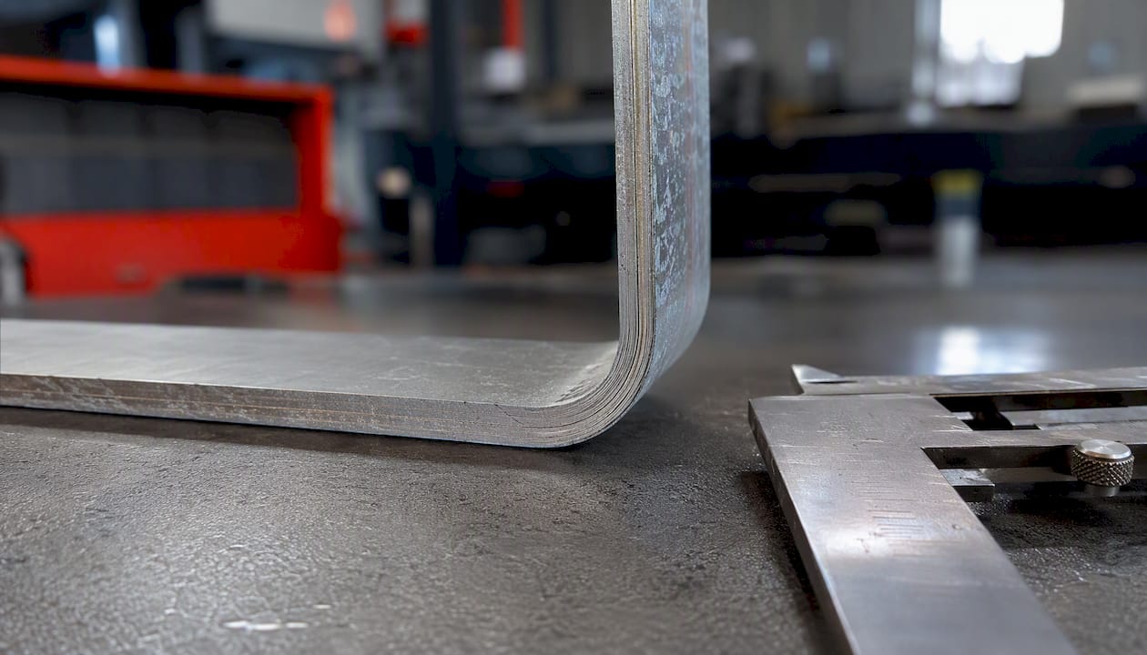 Close-up of bent metal cross section edge