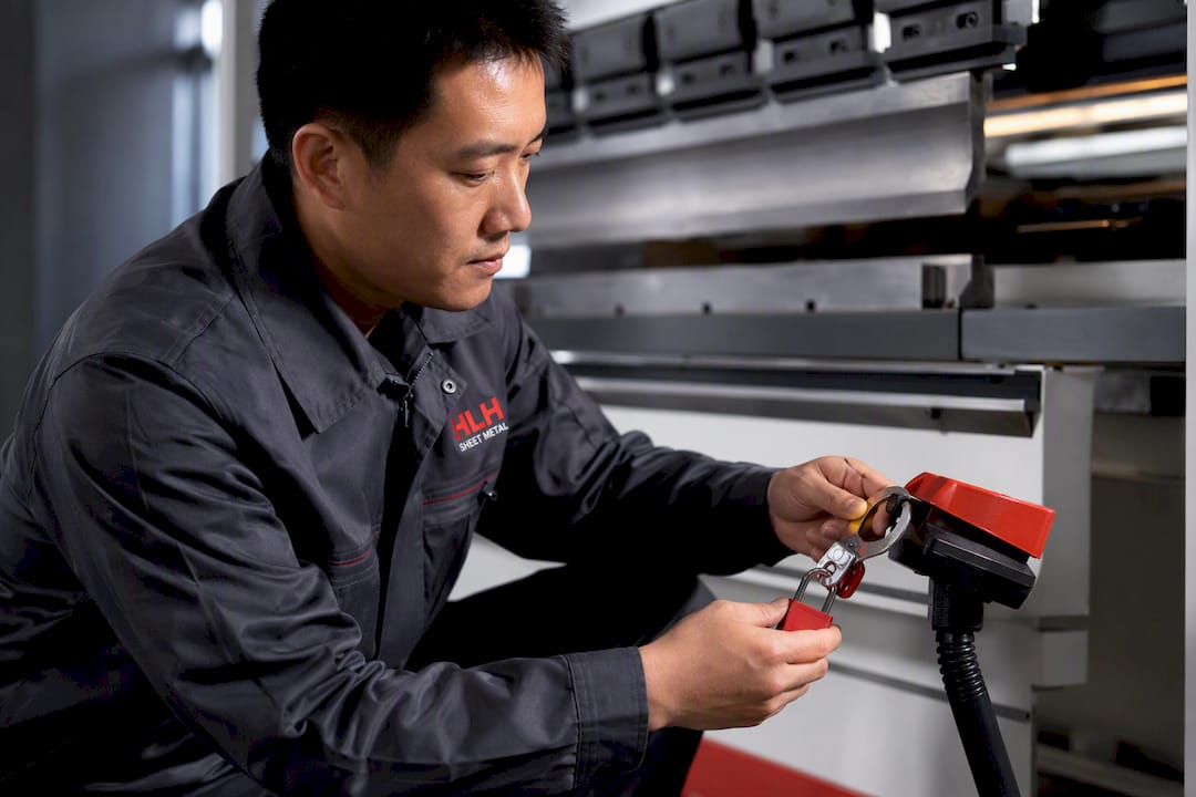 Chinese technician securing press brake bending pedal